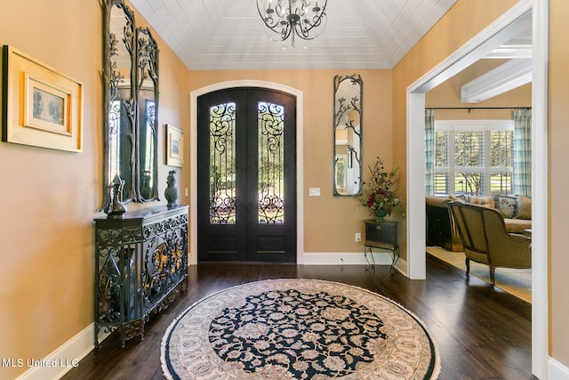 entrance foyer featuring french doors, wood ceiling, and dark hardwood / wood-style flooring