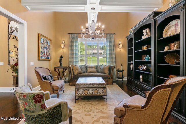 sitting room with coffered ceiling, a notable chandelier, beamed ceiling, and hardwood / wood-style floors