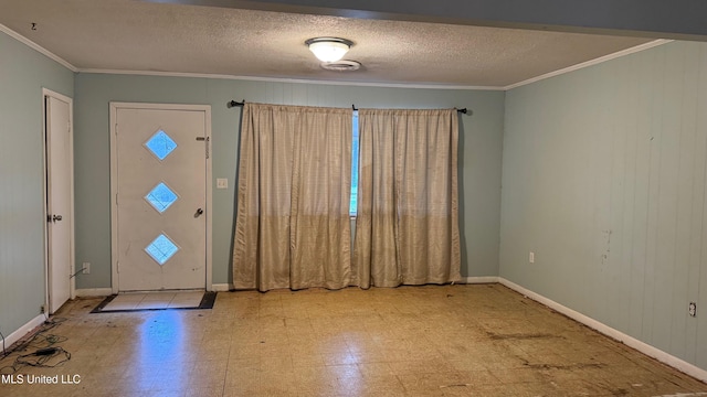 foyer featuring crown molding and a textured ceiling