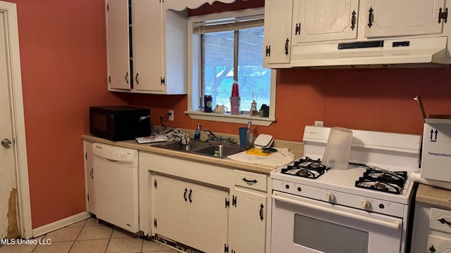 kitchen featuring sink, light tile patterned floors, white cabinets, and white appliances