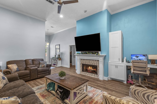 527 Pelahatchie Shore Dr, Brandon, MS 39047 - living room featuring ceiling fan, ornamental molding, wood finished floors, a tile fireplace, and baseboards
