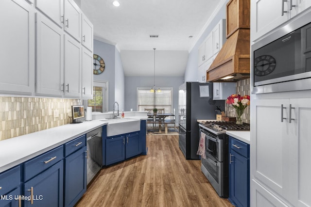 527 Pelahatchie Shore Dr, Brandon, MS 39047 - kitchen with appliances with stainless steel finishes, blue cabinets, a sink, white cabinetry, and recessed lighting