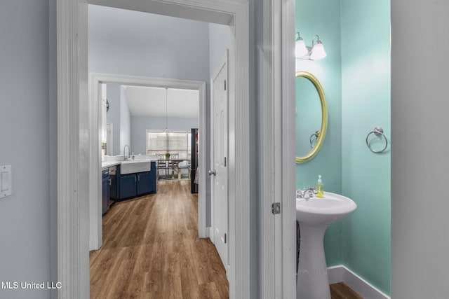 527 Pelahatchie Shore Dr, Brandon, MS 39047 - bathroom featuring wood finished floors, a sink, and baseboards