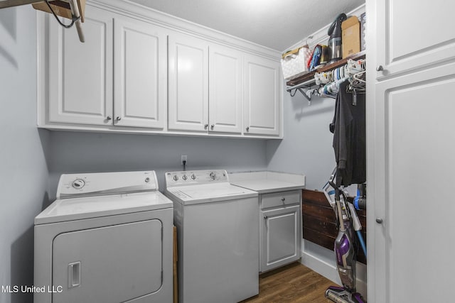 527 Pelahatchie Shore Dr, Brandon, MS 39047 - washroom featuring cabinet space, washer and dryer, and dark wood-type flooring