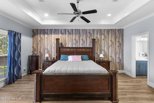 527 Pelahatchie Shore Dr, Brandon, MS 39047 - bedroom featuring light wood-style flooring, a tray ceiling, ensuite bathroom, wooden walls, and ornamental molding