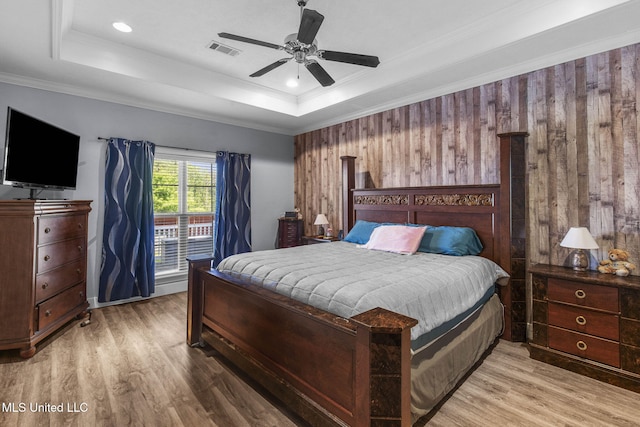 527 Pelahatchie Shore Dr, Brandon, MS 39047 - bedroom featuring wood finished floors, a tray ceiling, a ceiling fan, and crown molding