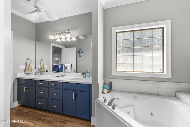 527 Pelahatchie Shore Dr, Brandon, MS 39047 - bathroom with ornamental molding, double vanity, a jetted tub, ceiling fan, and wood finished floors