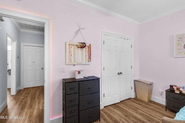 527 Pelahatchie Shore Dr, Brandon, MS 39047 - bedroom with wood finished floors, crown molding, baseboards, and a closet