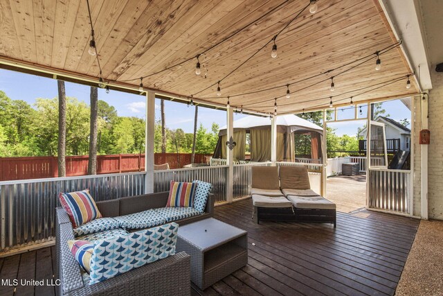 527 Pelahatchie Shore Dr, Brandon, MS 39047 - sunroom with outdoor lounge area, plenty of natural light, and track lighting