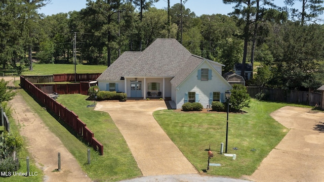 527 Pelahatchie Shore Dr, Brandon, MS 39047 - view of front of property featuring roof with shingles, concrete driveway, and covered porch