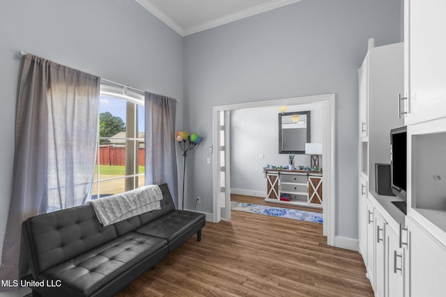 527 Pelahatchie Shore Dr, Brandon, MS 39047 - living area featuring a towering ceiling, crown molding, baseboards, and dark wood finished floors