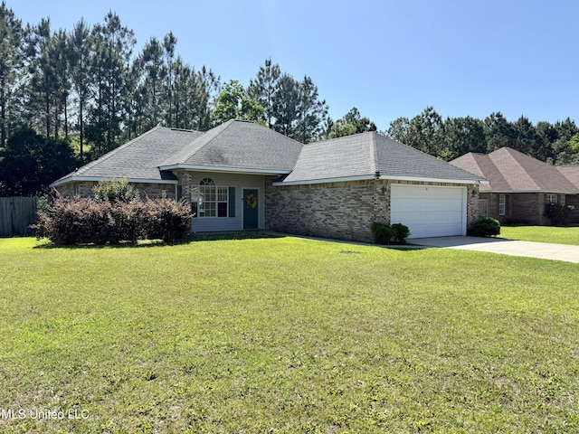 single story home with driveway, a front yard, and a garage
