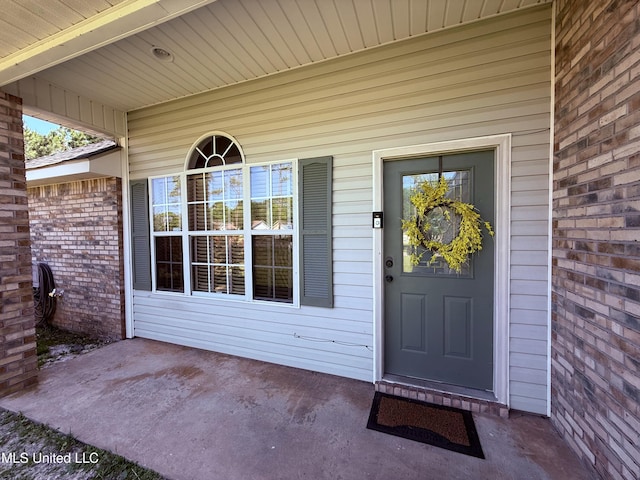 entrance to property with a patio area