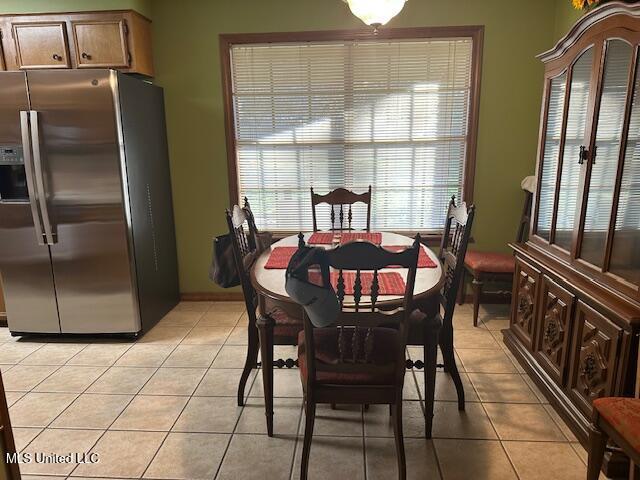 dining area featuring light tile patterned floors