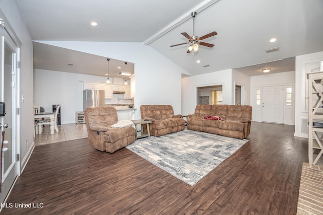 living room with beam ceiling, visible vents, dark wood-type flooring, and ceiling fan