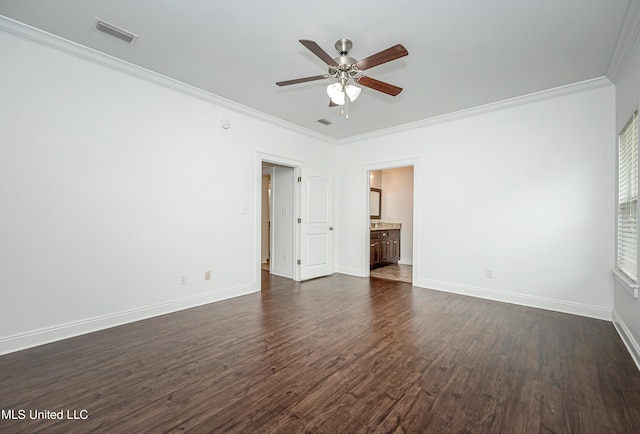 unfurnished bedroom with visible vents, baseboards, dark wood-type flooring, and ornamental molding