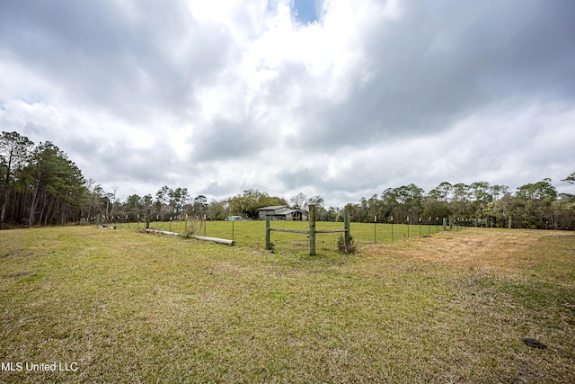 view of yard with a rural view