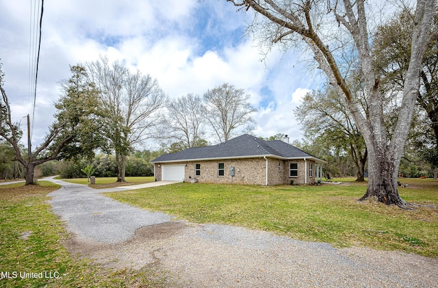 view of property exterior with brick siding, a lawn, an attached garage, and concrete driveway