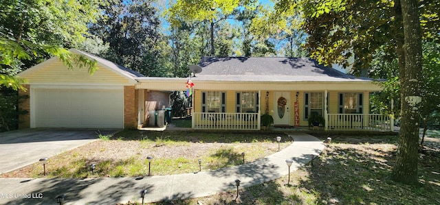 view of front of home with a porch and a garage