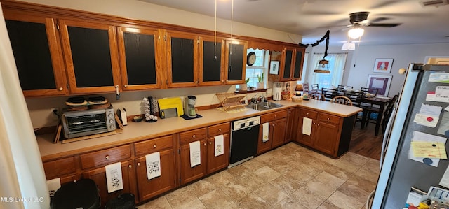 kitchen with sink, ceiling fan, black dishwasher, fridge, and kitchen peninsula