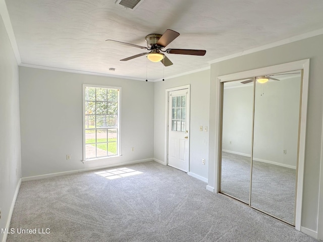 114 Leland St, Pearl, MS 39208 - unfurnished bedroom featuring carpet, a closet, baseboards, and ornamental molding