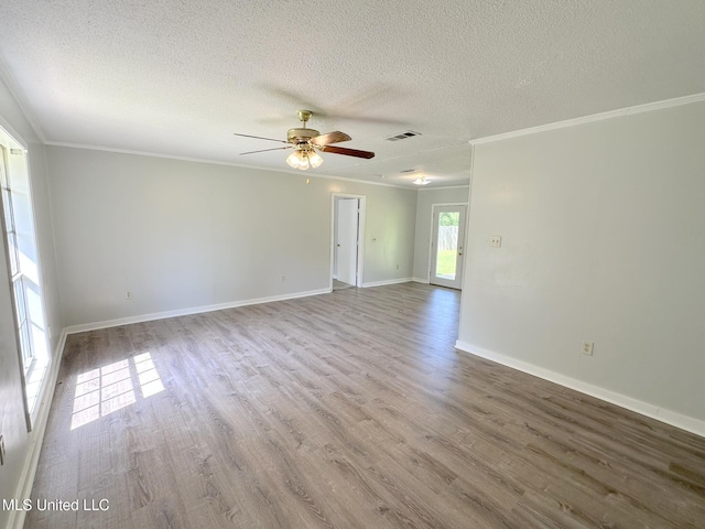 114 Leland St, Pearl, MS 39208 - spare room featuring a ceiling fan, ornamental molding, visible vents, and wood finished floors