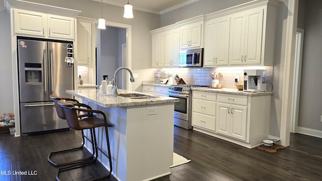 331 Emerald Way, Brandon, MS 39047 - kitchen with appliances with stainless steel finishes, a sink, tasteful backsplash, white cabinetry, and crown molding
