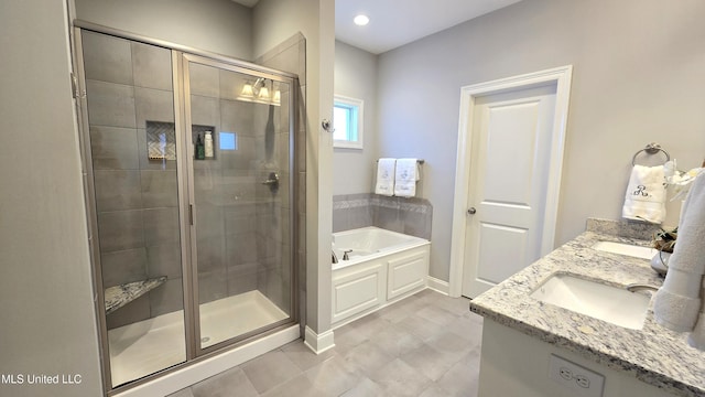 331 Emerald Way, Brandon, MS 39047 - full bath with a garden tub, a stall shower, baseboards, double vanity, and recessed lighting