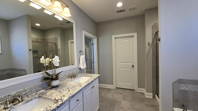 331 Emerald Way, Brandon, MS 39047 - full bathroom featuring a shower stall, double vanity, baseboards, recessed lighting, and a bath