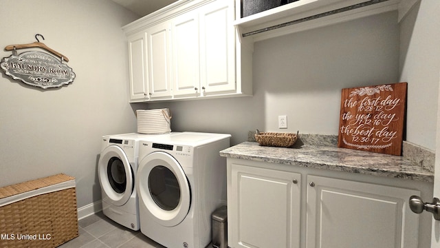 331 Emerald Way, Brandon, MS 39047 - washroom featuring cabinet space, washing machine and clothes dryer, light tile patterned flooring, and baseboards
