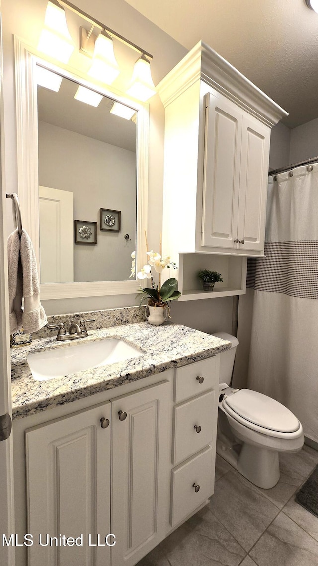 331 Emerald Way, Brandon, MS 39047 - full bathroom with vanity, toilet, and tile patterned flooring