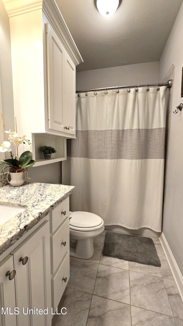 331 Emerald Way, Brandon, MS 39047 - bathroom featuring vanity, toilet, and curtained shower
