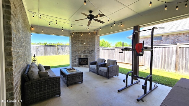 331 Emerald Way, Brandon, MS 39047 - fenced backyard featuring a patio area, ceiling fan, and an outdoor living space with a fireplace