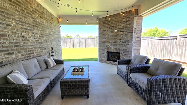 331 Emerald Way, Brandon, MS 39047 - fenced backyard with an outdoor living space with a fireplace and a patio area