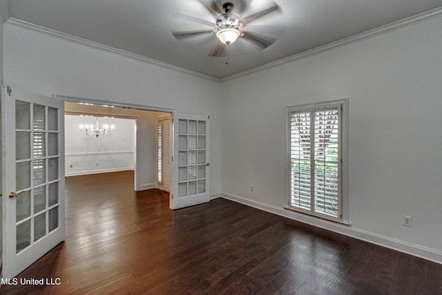 empty room with french doors, crown molding, and dark wood-type flooring