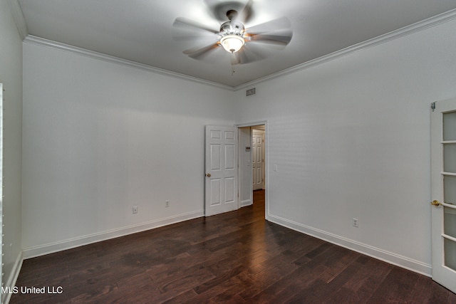 empty room featuring ceiling fan, crown molding, and dark hardwood / wood-style floors