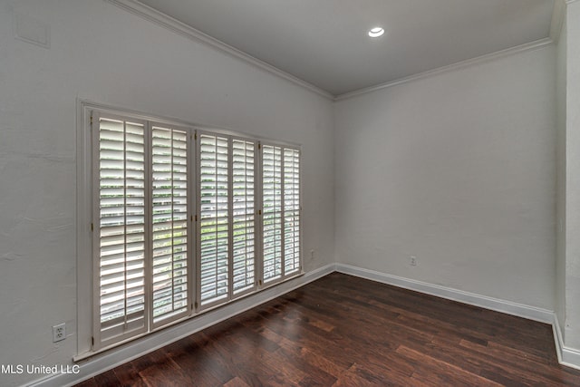 unfurnished room with ornamental molding, plenty of natural light, and dark hardwood / wood-style floors