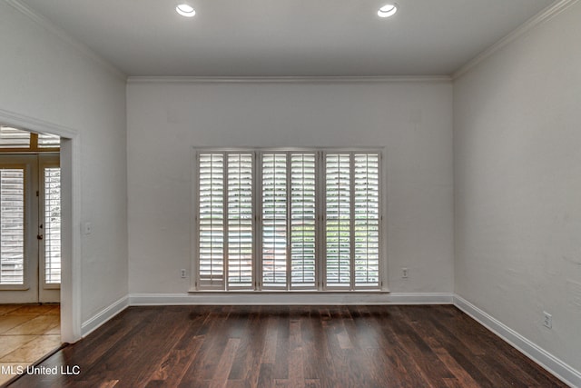 unfurnished room with crown molding and dark hardwood / wood-style flooring