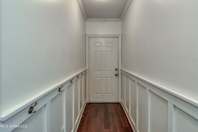 hall with ornamental molding and dark hardwood / wood-style floors