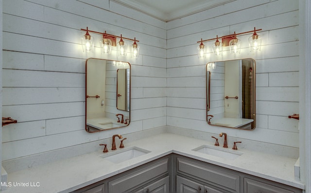 bathroom featuring vanity and wooden walls