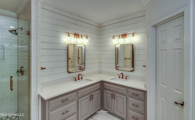 bathroom with vanity, ornamental molding, and walk in shower