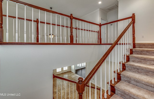 staircase featuring wood-type flooring