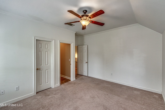 unfurnished bedroom with light carpet, ornamental molding, vaulted ceiling, and ceiling fan