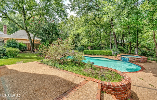 view of pool with an in ground hot tub and a patio