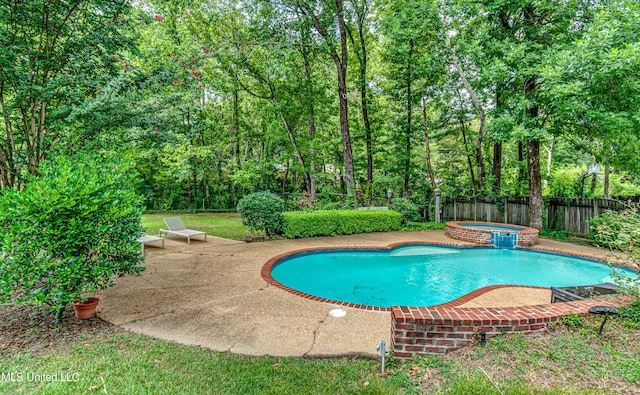 view of swimming pool with an in ground hot tub and a patio