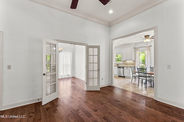 125 Rhodes Ln, Canton, MS 39046 - unfurnished room featuring french doors, a ceiling fan, wood finished floors, baseboards, and crown molding