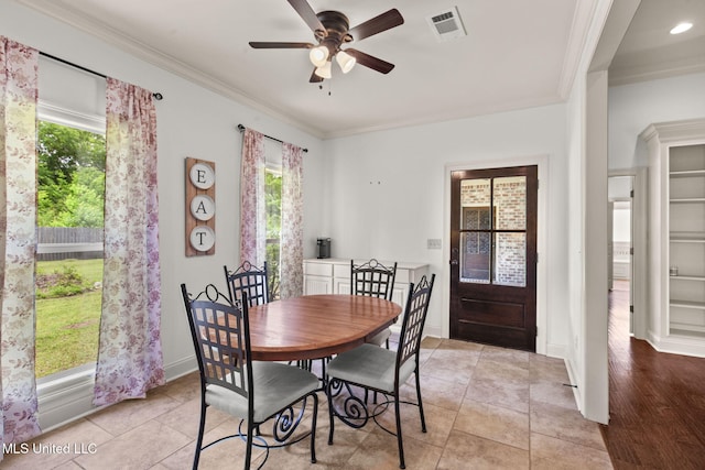 125 Rhodes Ln, Canton, MS 39046 - dining area featuring crown molding, ceiling fan, baseboards, and light tile patterned floors