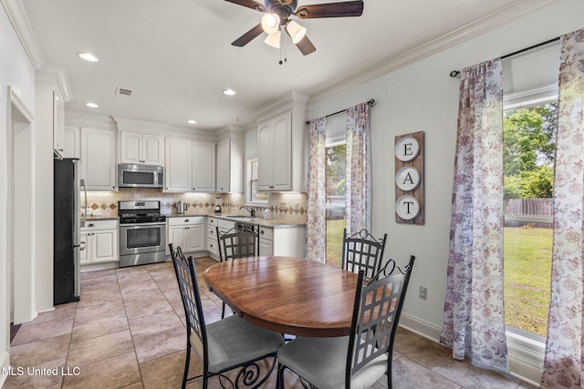 125 Rhodes Ln, Canton, MS 39046 - dining room featuring plenty of natural light, a ceiling fan, light tile patterned flooring, recessed lighting, and ornamental molding