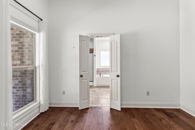 125 Rhodes Ln, Canton, MS 39046 - empty room featuring dark wood-style floors and baseboards