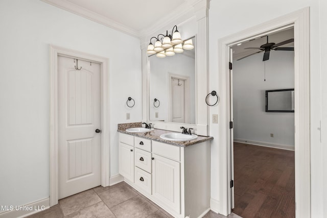 125 Rhodes Ln, Canton, MS 39046 - full bath with ornamental molding, ceiling fan, double vanity, baseboards, and wood finished floors